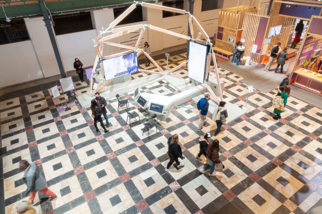 Visitors walking in Futures that unite hall