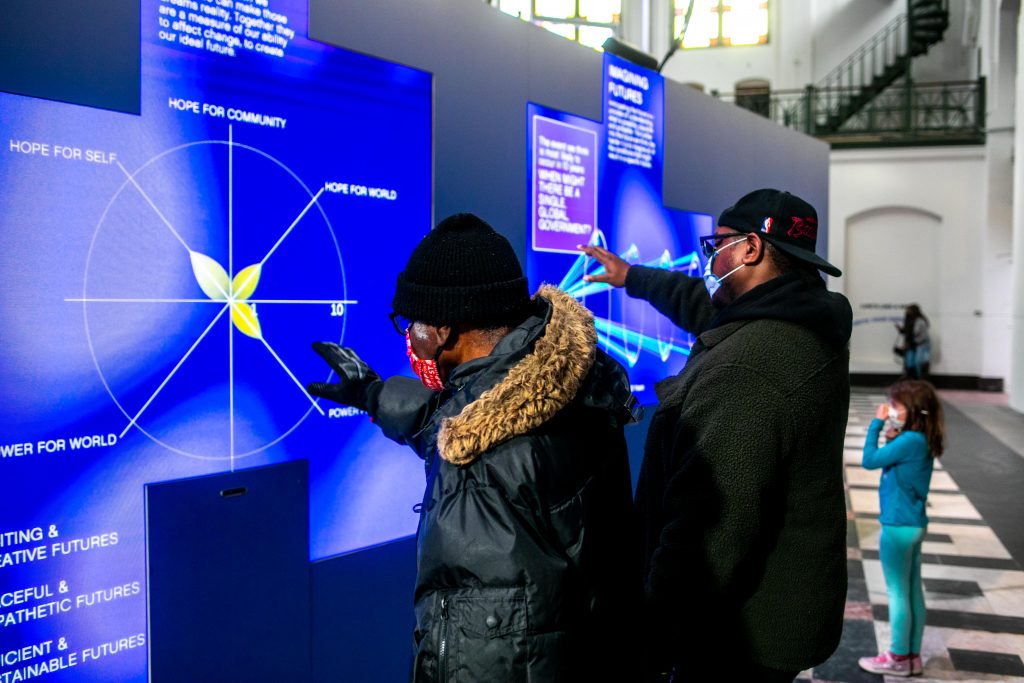 visitors interacting with beacons