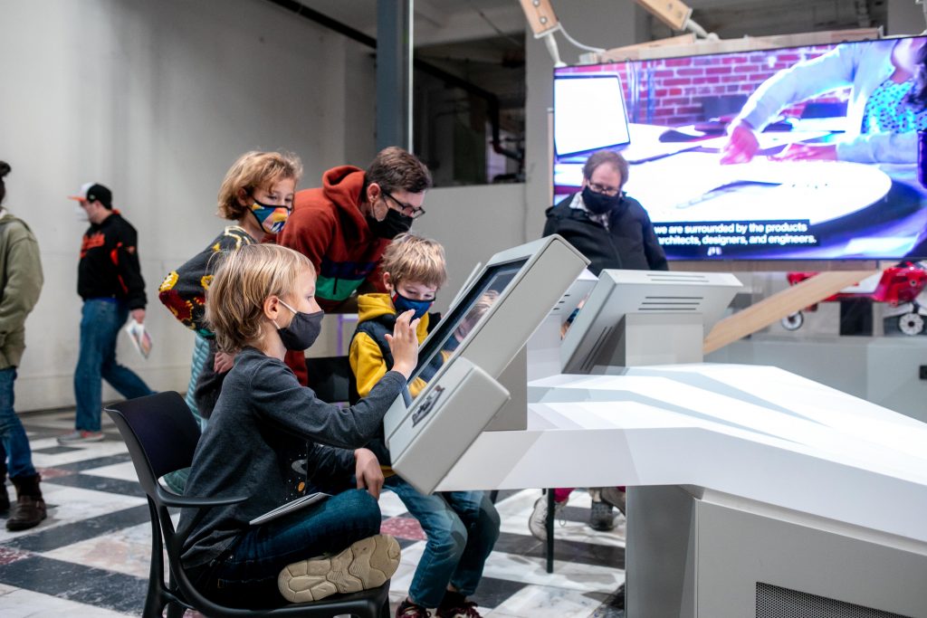 kids interacting with touch screen