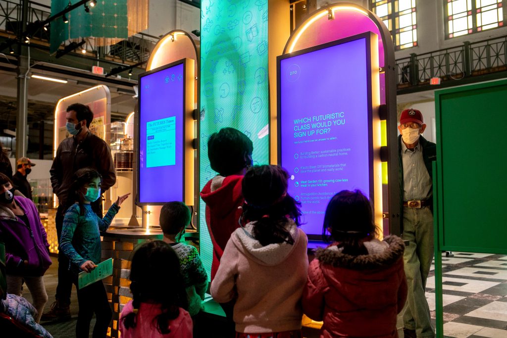 group of visitors play with beacons